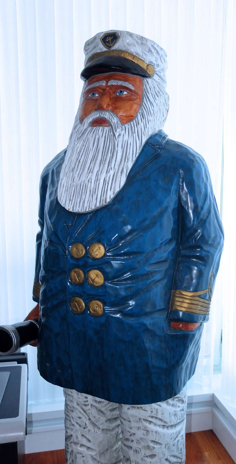 large carved wooden sea captain