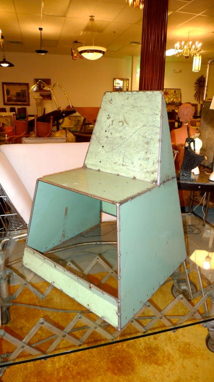 Crafted by industrial designer, Doug Meyer, out of welded vintage steel plate into a sturdy and unusual chair.  Could be used for dining or lounging.<br />
<br />
Cubby hole space underneath perfect for muddy Wellies.<br />
<br />
Available in