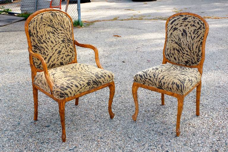 Set of six dining chairs, 4 side and two arm chairs, circa late 1970's, by Lewis Mittman.  The Chair frames have the classic silhouette of Louis XV however the frames are carved with flourishing palm leaf fronds in the style of Serge Roche.