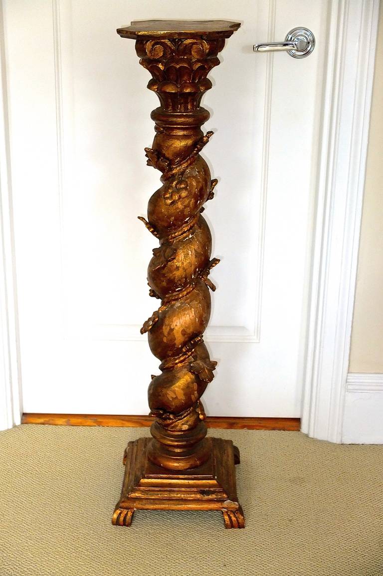 Italian barley twist pedestal column, carved wood gilded a coppery bronze tone.

Also available for an additional $750 is the putti / bambino figure seen in image 4, the patina of which is nearly identical to that of the column.
