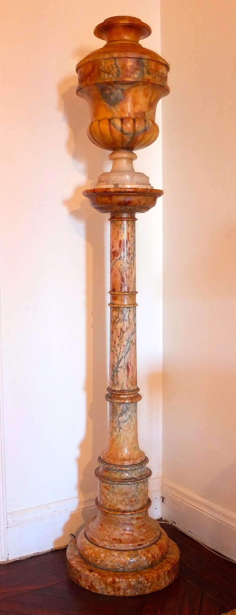 Hauntingly beautiful pair of 6 foot alabaster and marble urn form lamps on matching turned marble columns.  The way these lamps seem to straddle the moderne and neo-classical styles make me imagine how Robsjohn-Gibbings would have placed these in