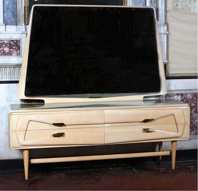 1950's Italian bedroom four drawer dresser in bleached maple by Silvio Cavatorta with large trapezoidal mirror.

Note, we have the matching king size bed, pair of nightstands and armoire.