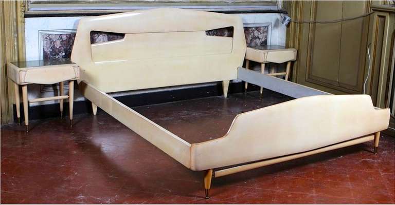 1950's Italian bleached maple modernist bed by Silvio Cavatorta.

We also have matching pair of nightstands, dresser with mirror and armoire.