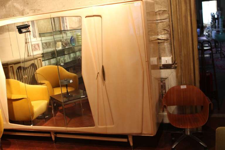 1950's Italian armoire in bleached maple by Silvio Cavatorta.

We also have the matching king size bed, dresser with mirror and pair of nightstands.