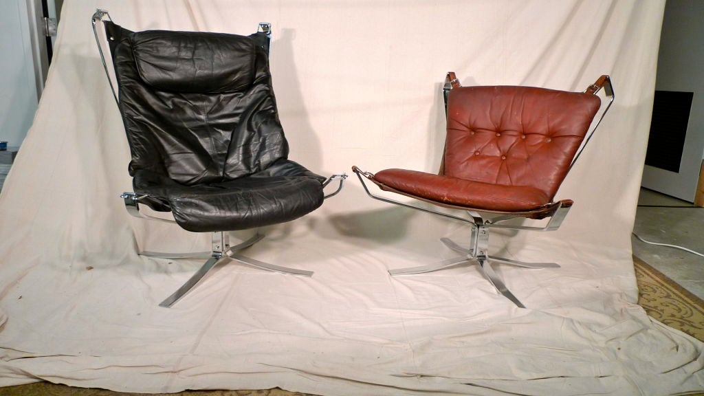 Classic Falcon chair in coveted chromed steel frame with cordovan-brown sling and brown leather tufted cushion.<br />
<br />
Early editions were made with chromed steel frames. The chromed frame edition was discontinued in 1973 due to high