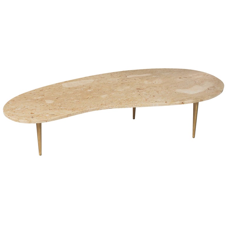 Rene Brancusi coffee table, USA, biomorphic marble top with polished finish, tapered brass legs, original finish, unsigned, 60