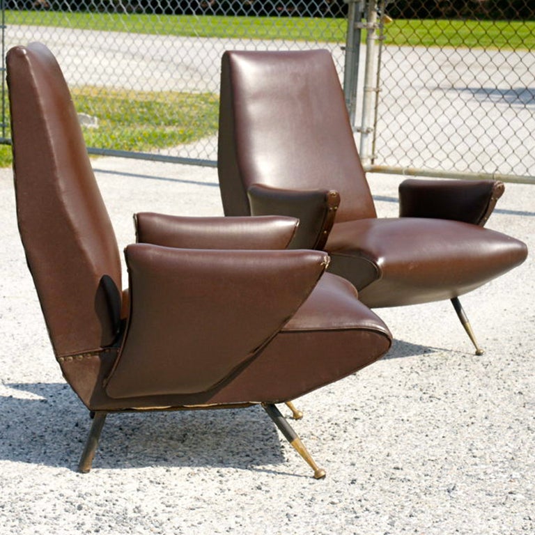 Late 1950's Italian lounge chairs by Nino Zoncada for Framar with steel legs and brass feet tips in original brown skai upholstery.

Giovanni 