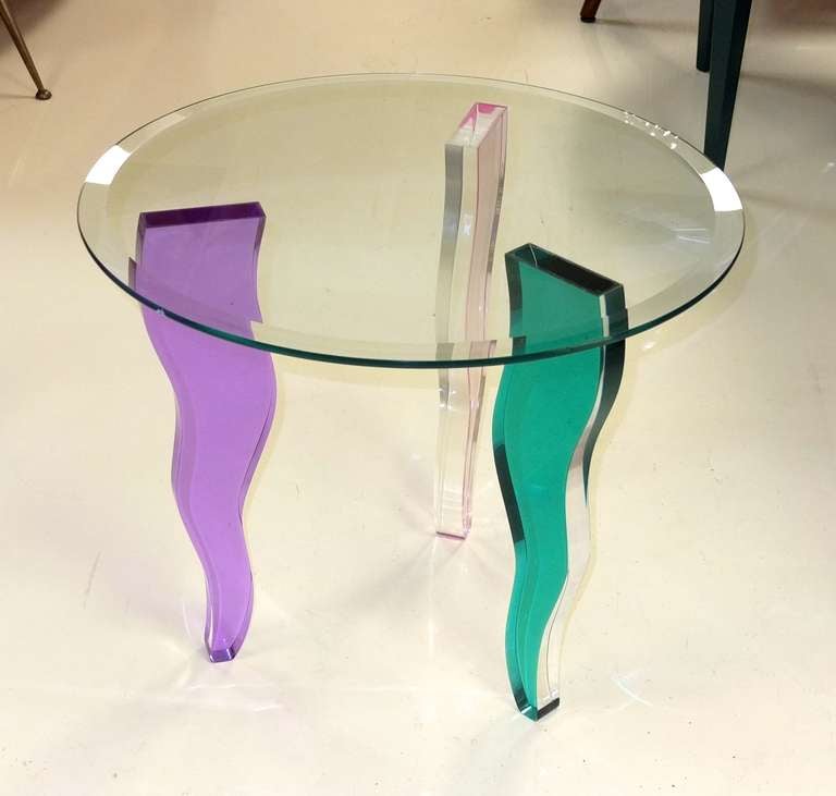 Cool modern occasional table with curvaceous lucite legs with optical effect colored lucite legs (pink, green and purple) bonded to round beveled glass top.