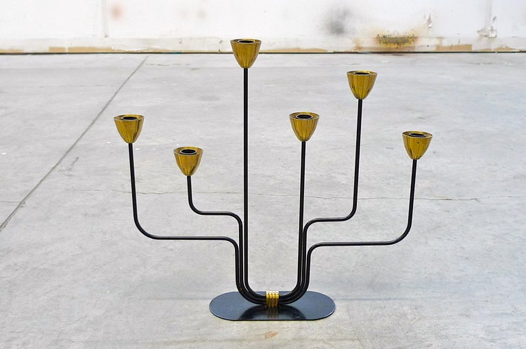 A large candelabra in brass and blackened metal by Swedish metals artist, Gunnar Ander for Ystad Metall. Mid-1950's