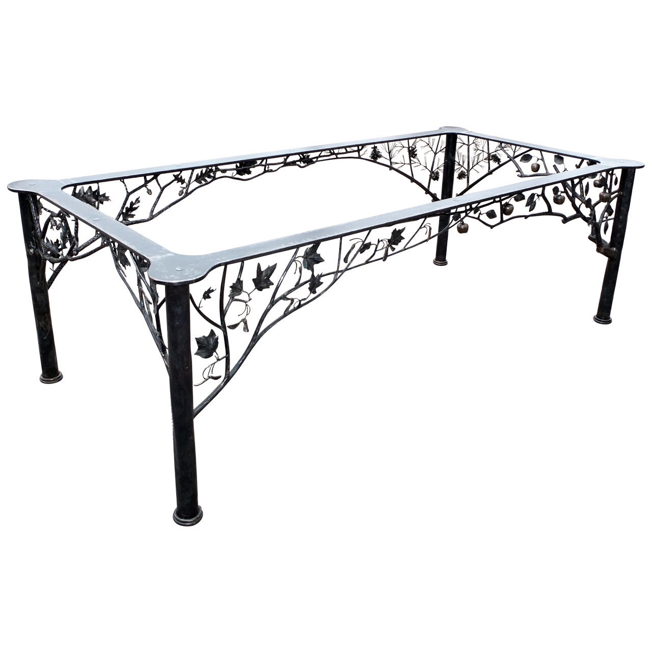 Custom commissioned rectangular fer forge dining table by noted blacksmith, Dereck Glaser. who crafted by hand and Hammer the remarkably realistic botanicals which adorn this table. Each leg depicts a certain season reflected by a tree. Winter is a