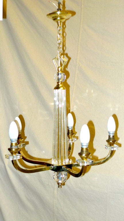 Pair of 4 Arm Chandeliers AND a single 5 Arm Chandelier by Jacques Adnet circa 1930s/1940's. Luxurious French Modernist design combined with geometric simplicity.<br />
<br />
Price for the suite of 3 is $14,900.<br />
Price for the Pair of 4