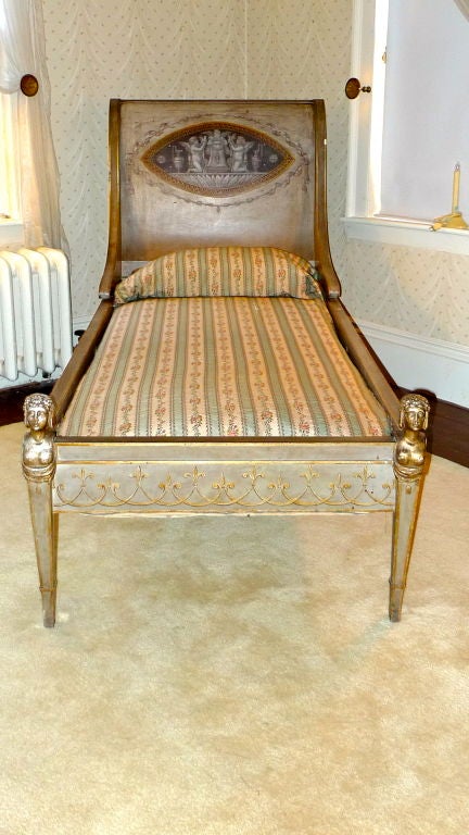 Striking and highly decorative, this antique Directoire daybed has been with the same family for the last 95 years when it was purchased from an antique dealer in France.<br />
<br />
Painted medallion is 12