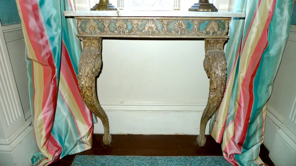 SATURDAY SALE (1/18)

A pair of Italian neoclassical half consoles, aqua-green painted gesso over hand-carved wood two scrolled legs and shell motif on frieze with white marble top. Also known as bracket consoles they are perfect for a narrow space