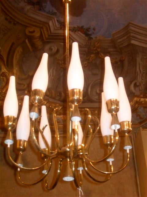 Absolutely stunning 9 light chandelier with frosted glass candle shades and brass tapers designed in 1950 by Angelo Lelii for Arredoluce Monza. Model No. 12613

See other BG listings for a pair of the matching floor lamps.