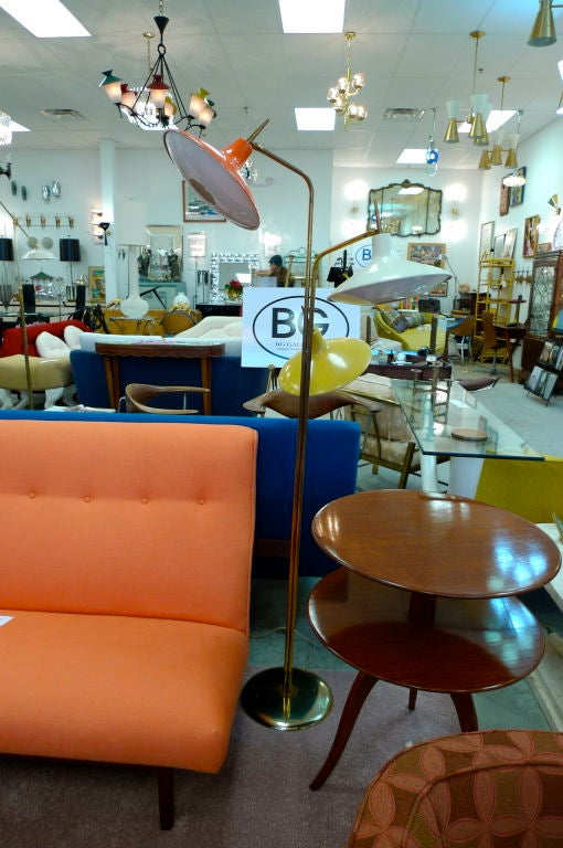 Fantastic and colorful floor lamp by the Laurel Lamp Company with orange, yellow and white 'space ship' heads very similar to the designs Gino Sarfatti did for Lightolier during the same period.  Each head is a foot in diameter and 9 inches deep,