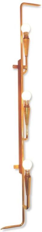 Unusual long wall light,consisting of a long brass rod which mounts to the wall on a slender vertical brace of polished teak.<br />
<br />
Illumination comes from three brass candle arms fitted with original French bayonet sockets.  (A supply of