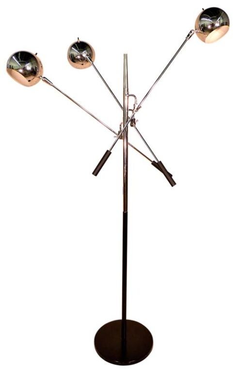 This 1960's 3 arm floor lamp with chrome eyeball heads is possibly by Laurel, Lightolier or Raymor but is clearly an homage to Gino Sarfatti's Triennale lamp produced by Arredoluce.<br />
<br />
Dual-control switches; main switch on pole plus each