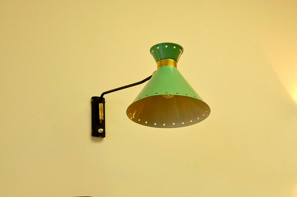 Similar to the Diabolo by Pierre Guariche this original French 1950's articulating wall light has its original green enameled reflector and is rewired.