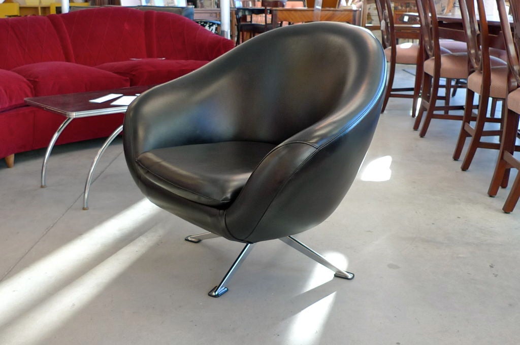 Chromed steel four star base and swiveling pod chair with separate cushion, covered in black vinyl, after Pierre Guariche. <br />
<br />
Great for a jet set kid's room.<br />
<br />
Maker unknown.  Marked 