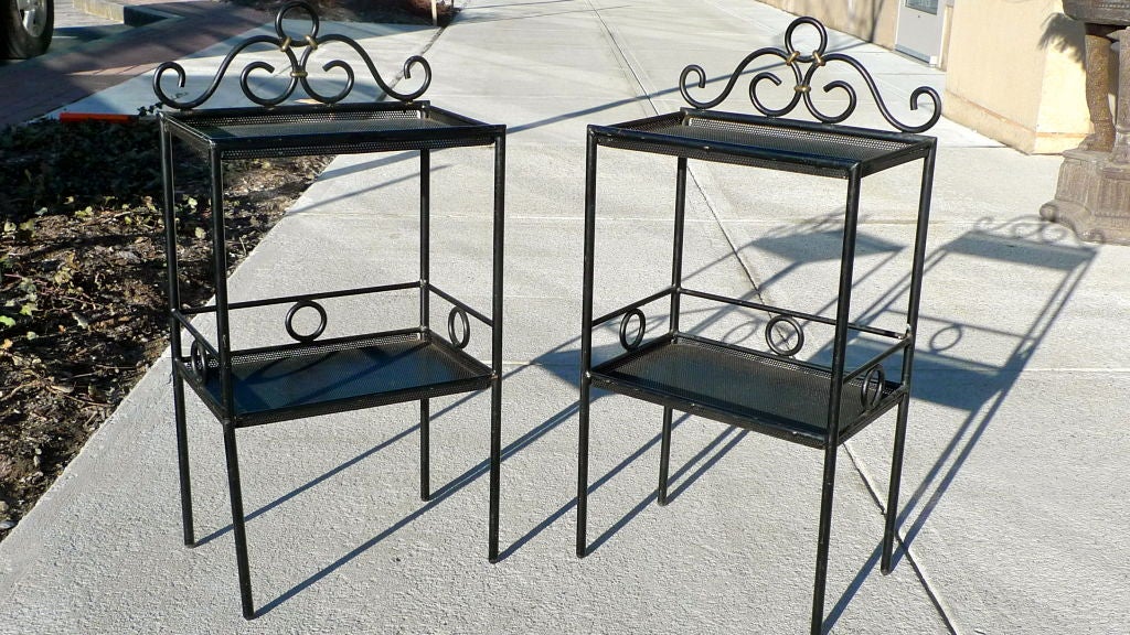 Lovely pair of forged iron and perforated steel neo-classical 'chevets' or night side tables in the manner of Matthieu Mategot (see original catalog page from Mategot and note striking similarity). Total height is 27 inches and 22.75 inches from
