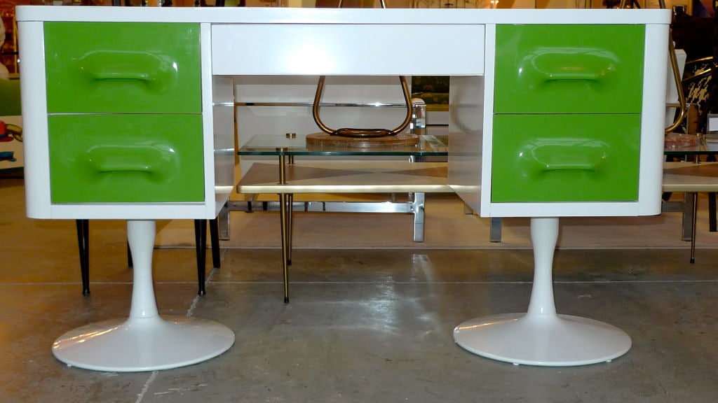 Mold injection plastic drawer panels in white painted case with white laminate top on pair of painted cast metal 'Tulip' pedestal legs. An homage to Raymond Loewy. Produced by Broyhill. From the Premier Collection.<br />
<br />
Back is finished in