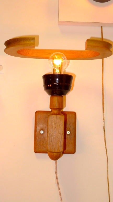 Pair of French wall sconces in light oak with ceramic caps by Guillerme et Chambron for Votre Maison.  Stamped on reverse.