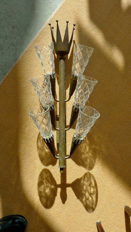 A large pair of unusual sconces topped by Viscount crowns.<br />
<br />
Each of the six arms is fitted with a bayonet socket and holds a cut crystal 'shade' although I believe they look more modern without them