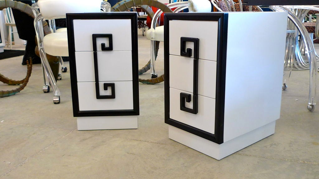 Pair of nightstands from Kittinger's iconic Mandarin collection of the late 1940's, freshly refinished in high gloss enamel white with black trim.  Greek key motif drawer pulls for the three drawers.<br />
<br />
See companion desk/vanity and