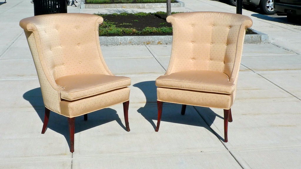 This is an elegant pair of vintage tall curved back slipper chairs. Rolled collar.  Detached seat cushion.  Button tufted.  Carved mahogany legs.  <br />
<br />
Price is for the pair.