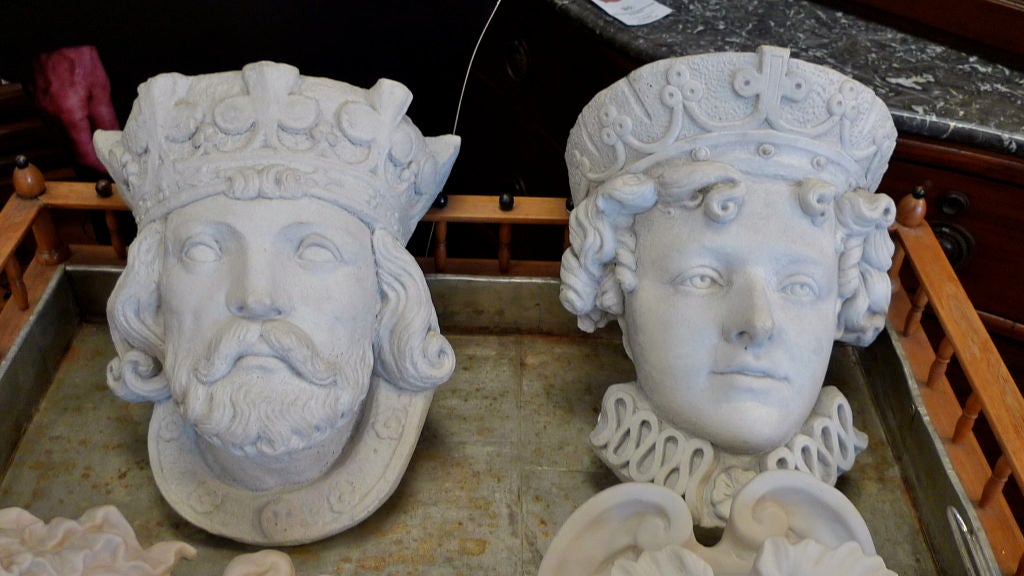 Cast stone decorative wall appliques in the form of a Medieval King and Queen. Although the image on the left bears a resemblance to Edward 1st, both in terms of features and the crown he is wearing, the figure on the appears to have Elizabethan