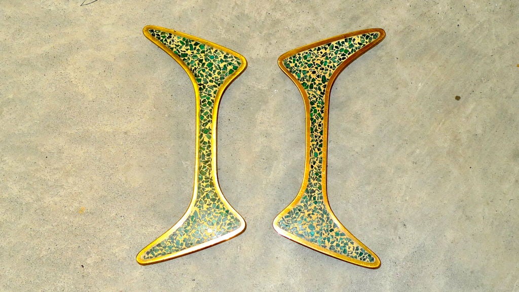 These are extraordinary door or draw handles in hand cast solid brass with green glass terrazzo inlay. The quality is remarkable.  They have a sculptural biomorphic amoeba-like form. I can only imagine the Ponti-esque cabinetry for which they were