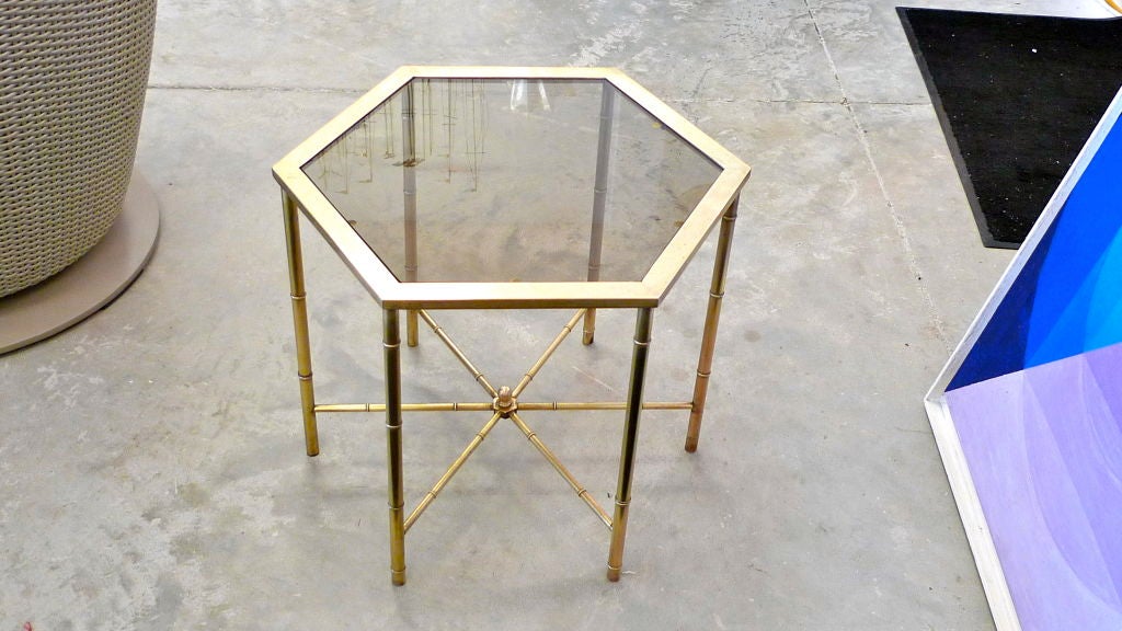 Pair of interlocking hexagonal faux bamboo occasional tables by Mastercraft with original inset tinted hexagonal glass tops.<br />
<br />
Price if for the pair.