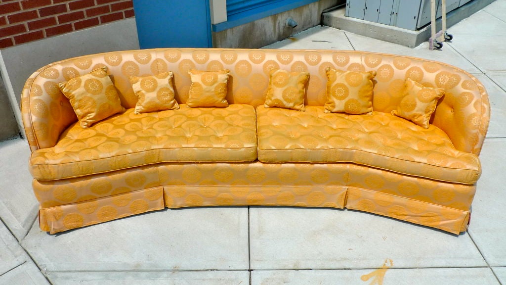 Long and impressive this Henredon sofa is in immaculate condition apart from some fraying to the welting on the front of the two seat cushions.

Re-upholstered in the 1970's in a a golden pumpkin silk with Asian motif.

Beautiful wooden legs, a