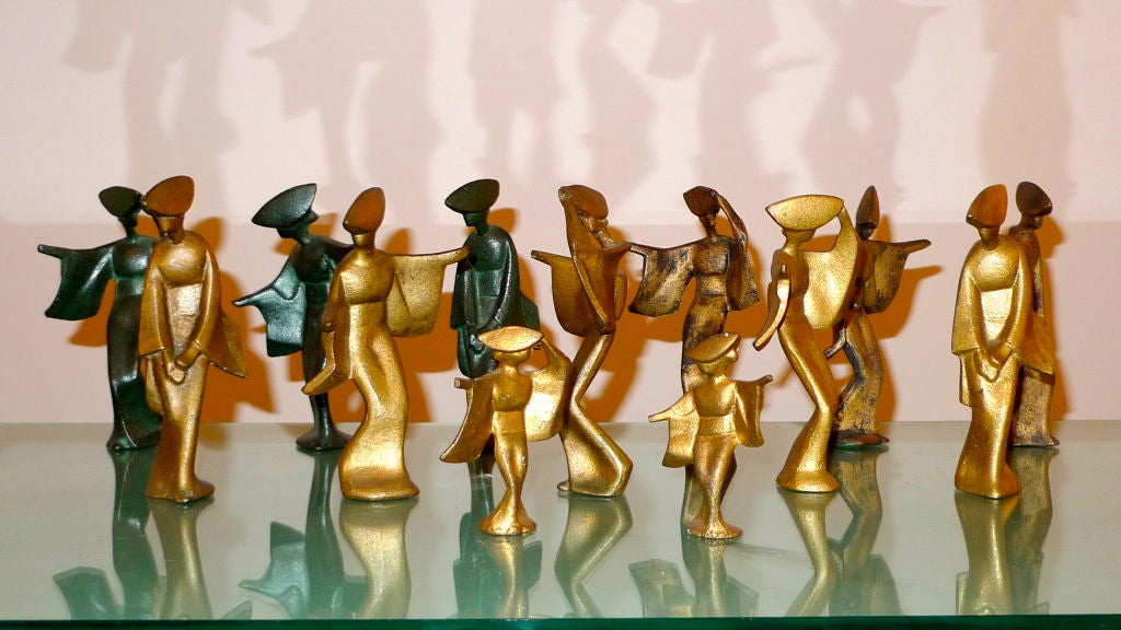 These intriguing cast iron brutalist figures of Geisha dancers will add a playful accent to your James Mont inspired interiors.<br />
<br />
<br />
The 3 blackish-green are 7 inches tall and are $SOLD for the set of 3.<br />
<br />
The 5 gold