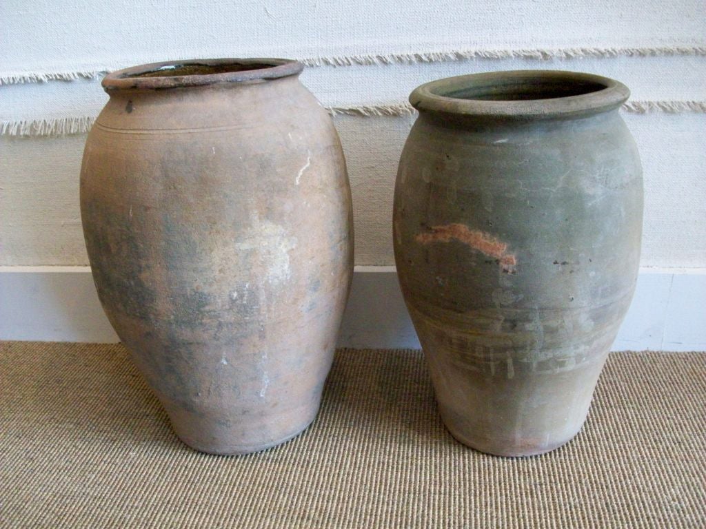 large Italian olive jars with great patina.  Larger one is approx: 18.25