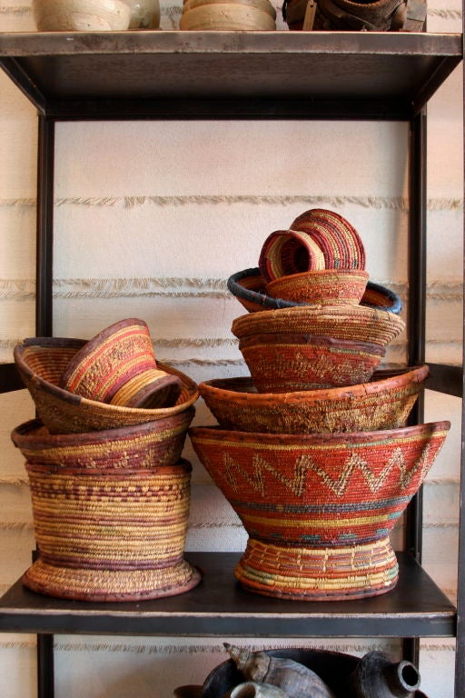 Handsome collection of baskets purchased from villagers of the Yemeni/Saudi border. <br />
Woven reed, most have leather bands on top and bottom.<br />
20th century pieces were not woven for tourists but used in the homes of the locals.<br />
12