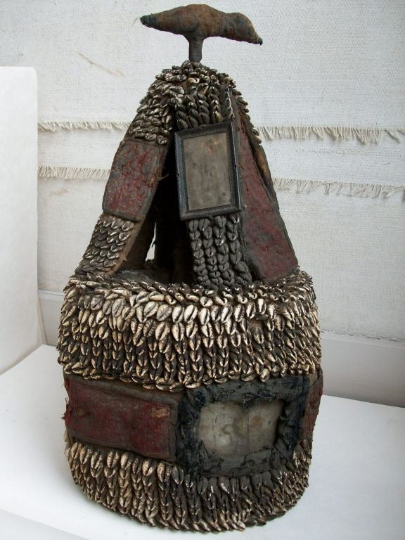 This headdress is from the Yoruba Tribe of Nigeria.  It is a shrine to one's 
