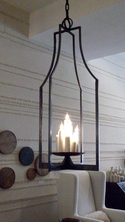 Custom elongated iron lantern by Michael Del Piero.
This Classic lantern is made to order. The elongated shape updates a Classic Includes nine beeswax candle sleeves and is available in custom sizing.