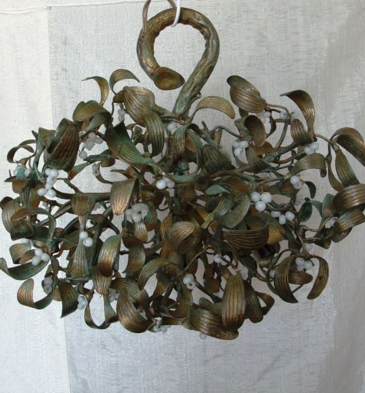 This brass ceiling sculpture chandelier  withe little white glass pearls , having its original patine has been re wired for USA , inside the bowl are 4 electric parts for  bulbs.