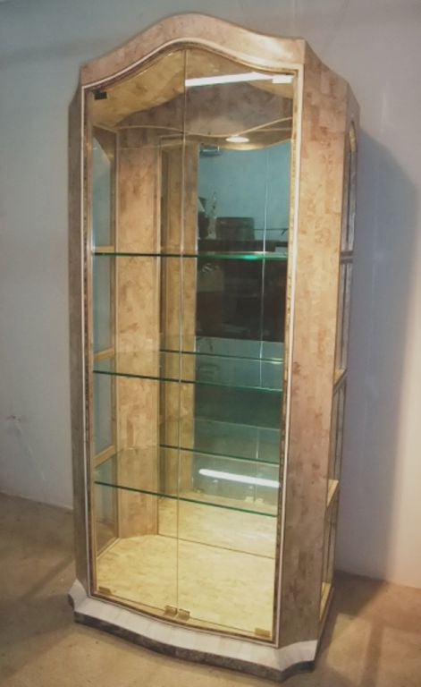 Inlaid brass and tessellated fossil stone vitrine.