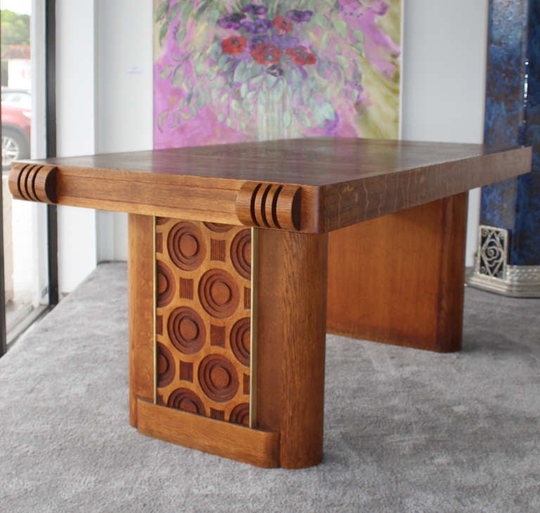High quality table designed by Charles DUDOUYT. 
Architectural and geometrical moldings.
Refined and sophisticated details.
Extremely modern conception for this period. 
Bronze hardwares emphasizing the rigourous lines. 
Quality golden oak. Two