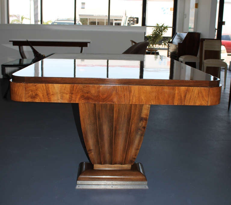 Spectacularly long rectangular French Art Deco Dinning Table can accommodate 18 to 20 people. Made of prestigious walnut wood.
Includes a total of 6 EXTENSIONS (3x 19.75in on each side). 
Total length: 183.5in. Beautiful proportions !
Original