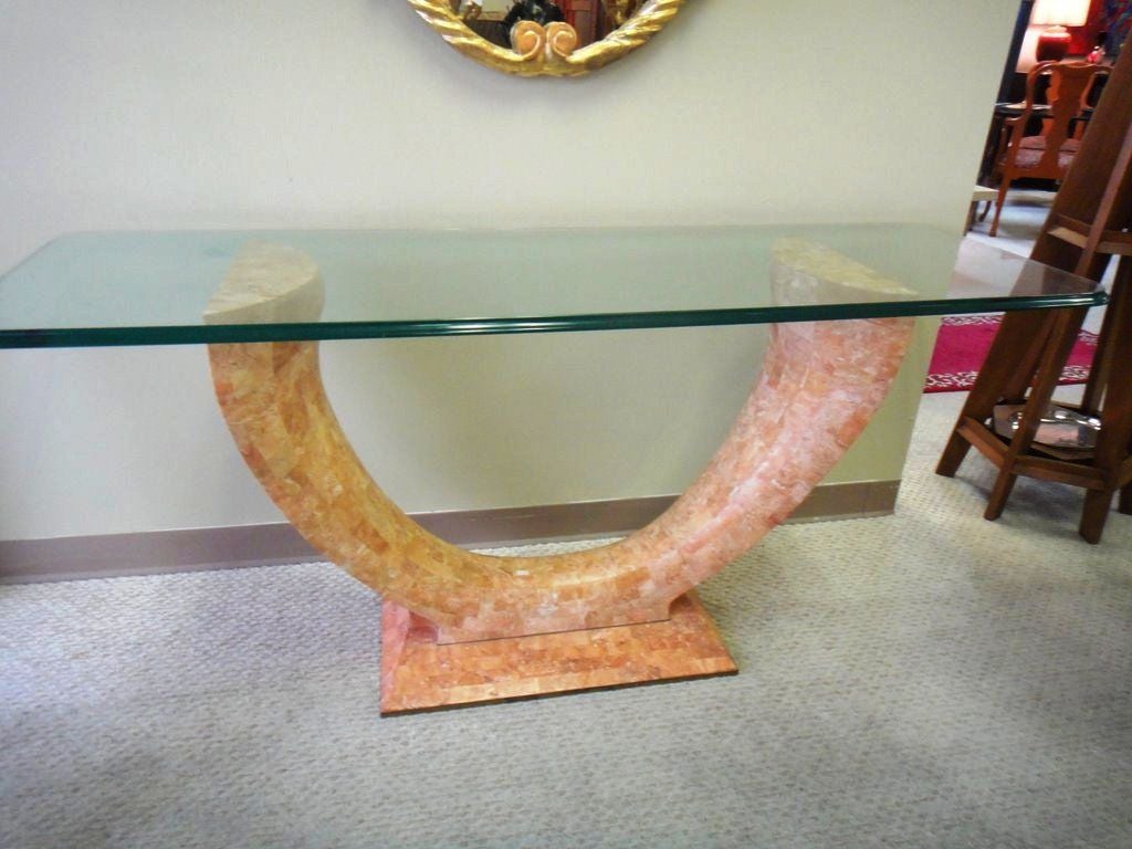 Elegant curved lines tesseled stone base .
 All around the rectangular glass top, round hedges.
This base could fit with a round glass top as well for an entrance table .
or dining Table as well.
