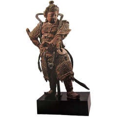 A large wood and stucco figure of a Guardian