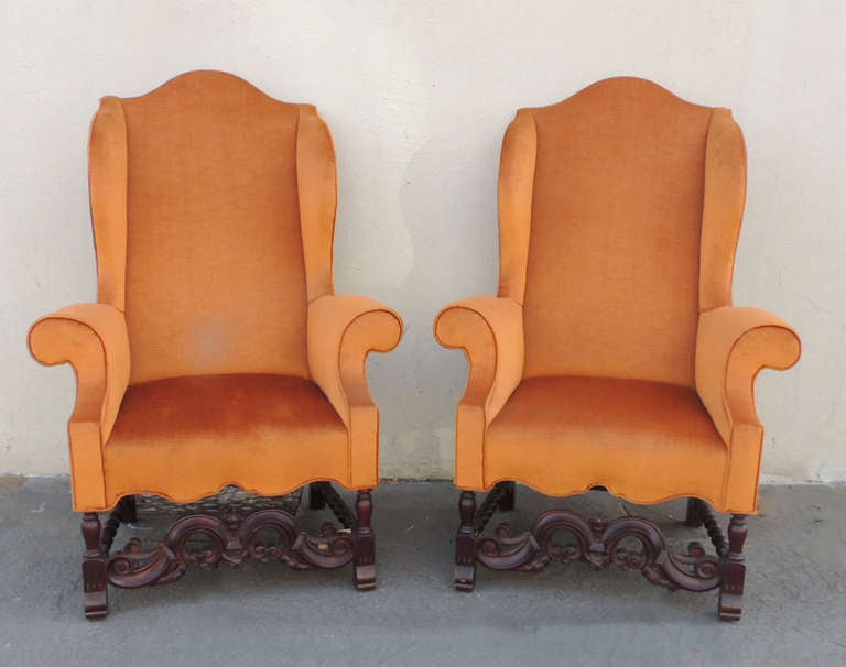 This beautiful pair of chairs were made in England during the 19th Century. The bottom of the chairs are made of carved mahogany. The design on the legs feature scrolls and hand turned rails.