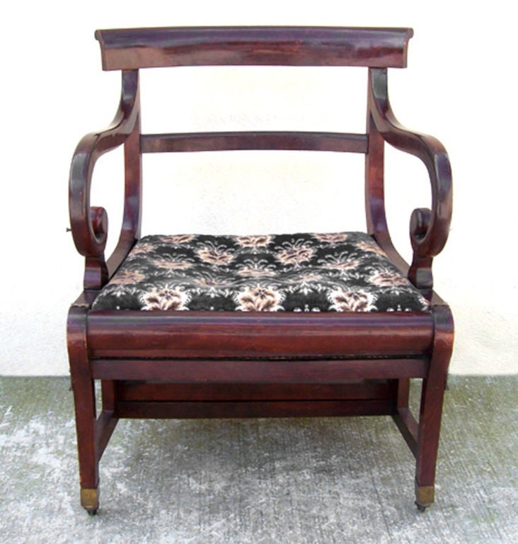 A very unique mahogany chair that also function as library steps.  The pivoting chair section roatates to rest on the crest rail creating four steps.
