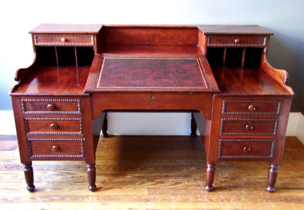 This walnut plantation desk was made in New Orleans about 1835 and possibly built and retailed by the noted cabinet making firm of the McCracken Brothers. There are similarities between this desk and a labeled McCracken desk at Melrose Plantation in