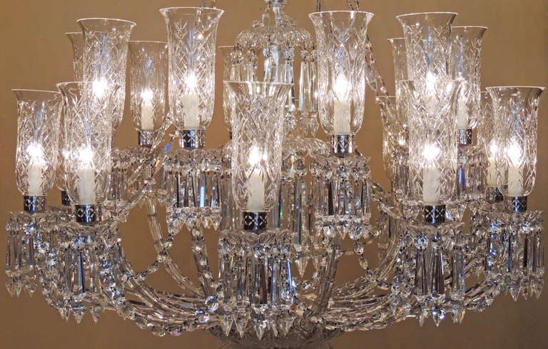 This monumental chandelier has wonderful dynamism. The top canopy is adorned with crystal candy canes that drip drop crystal. The main shaft is decorated from top to bottom with crystal stem pieces in graduating size, each adorned with graduated