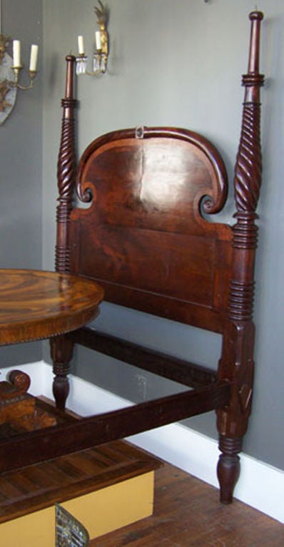 A superb and rare period mahogany poster bed from St.Croix.<br />
This is the finest Caribbean bed available. The Ram's Head turnings on either side of the headboard reflect the St. Croix<br />
origin. The crotch-cut mahogany used by the maker