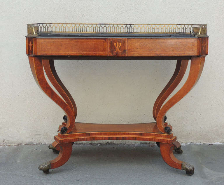 This jardiniere was made in England, circa 1810. This jardiniere was used as a planter for indoor plants. This unusual regency piece is made of amboyna wood with inlay. The metal inside section is removable and is original to the piece. The top lip